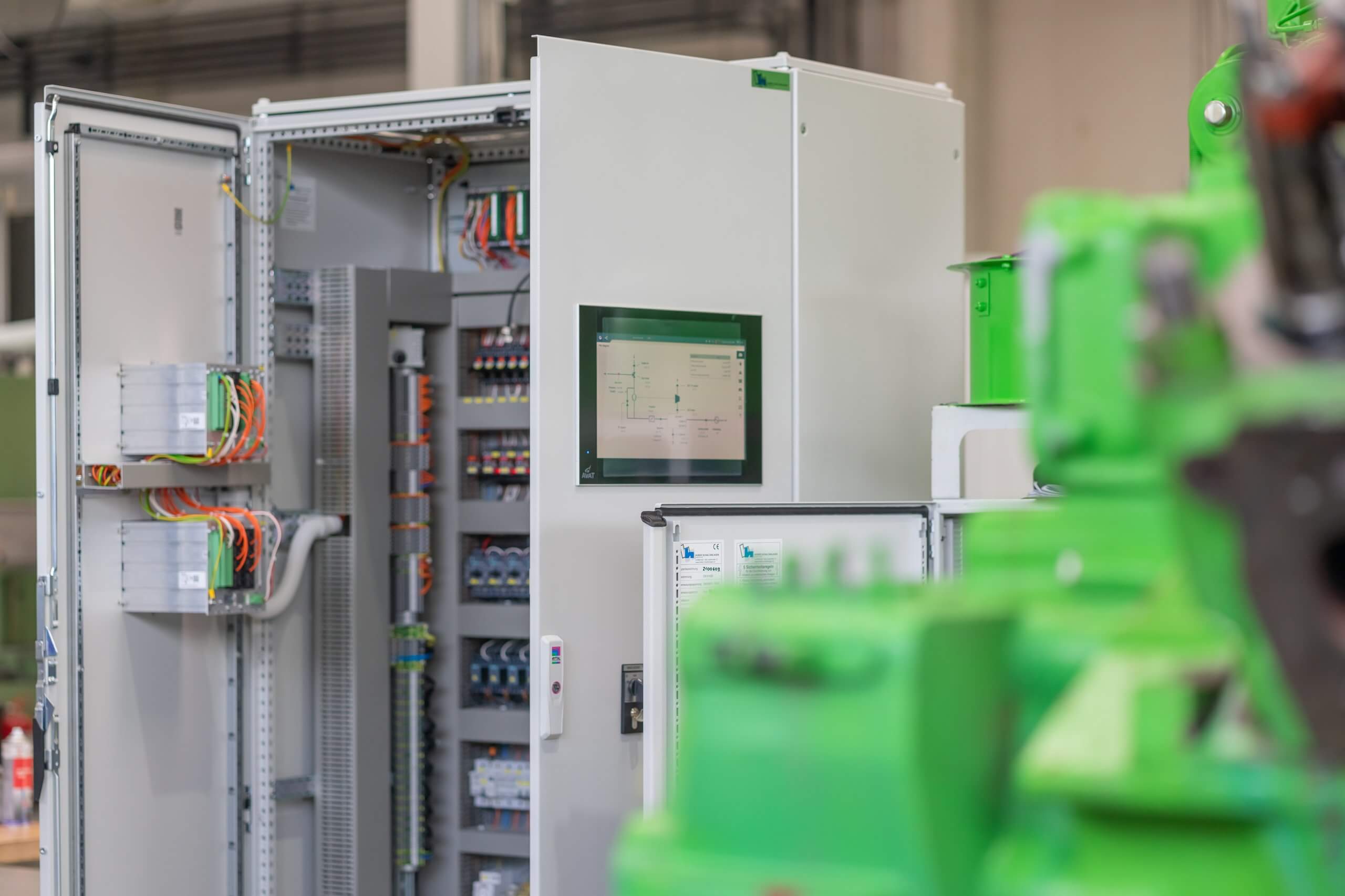 Technician repairing servers in a data center illuminated by blue lighting